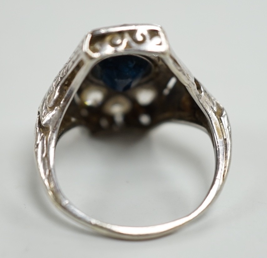A 1940's? white metal, sapphire and diamond cluster set hexagonal dress ring, size L, gross weight 4.6 grams.